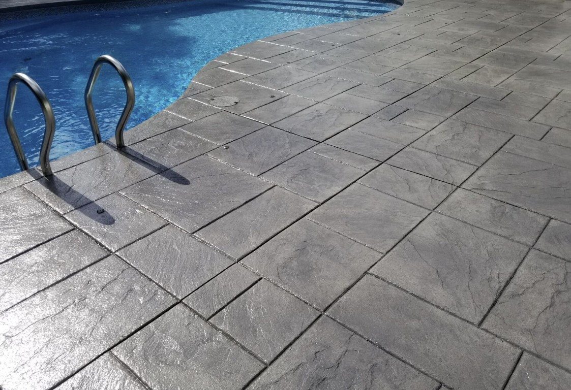 Stamped concrete patio installation in Perth Amboy, NJ with decorative patterns